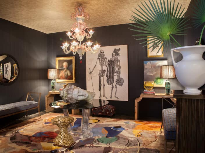 Eclectic room with a blend of classic and modern art, unique furniture, and a striking chandelier